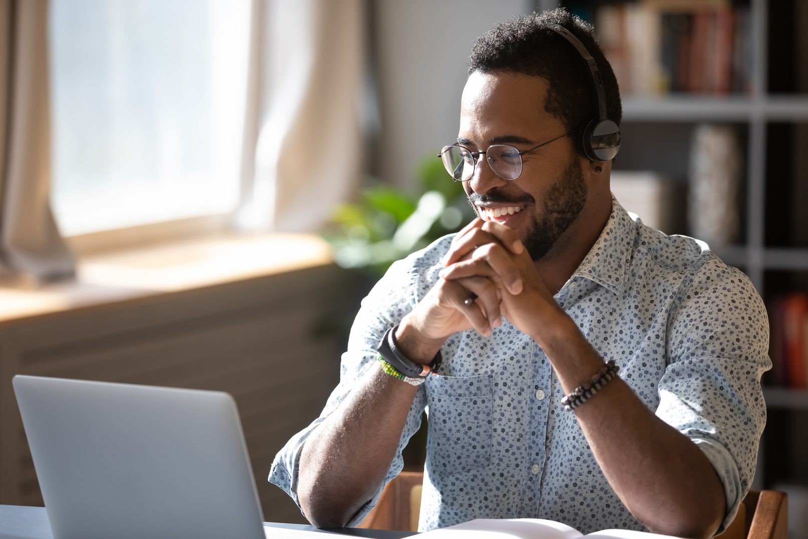 Man Calling Patient Via Laptop